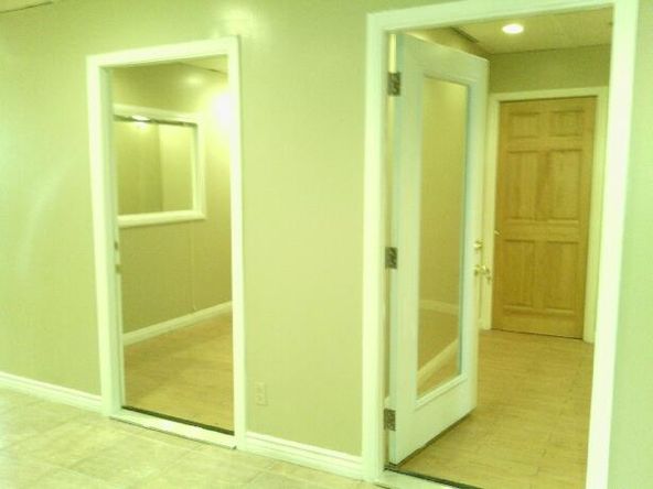 Ground floor office with beautiful tile entry and reception. Several uses.